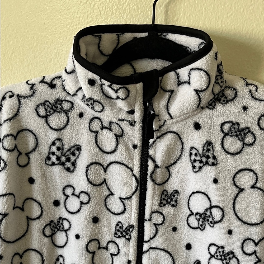 Disney Minnie Mouse silhouette black and white fleece zipper jacket.